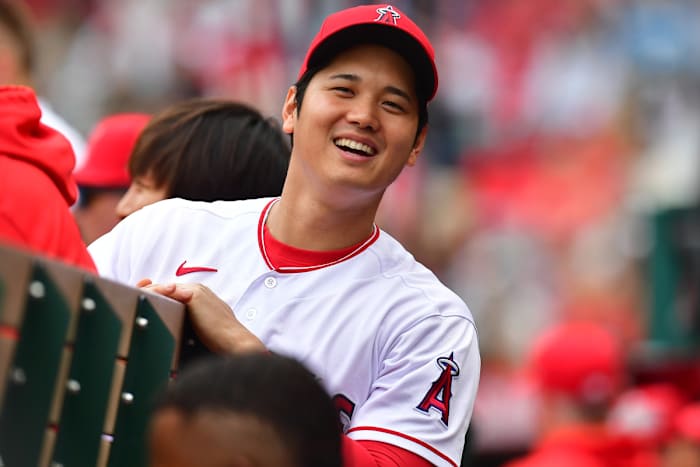 Los Angeles Angels designated hitter Shohei Ohtani smiles in the dugout. (2023)